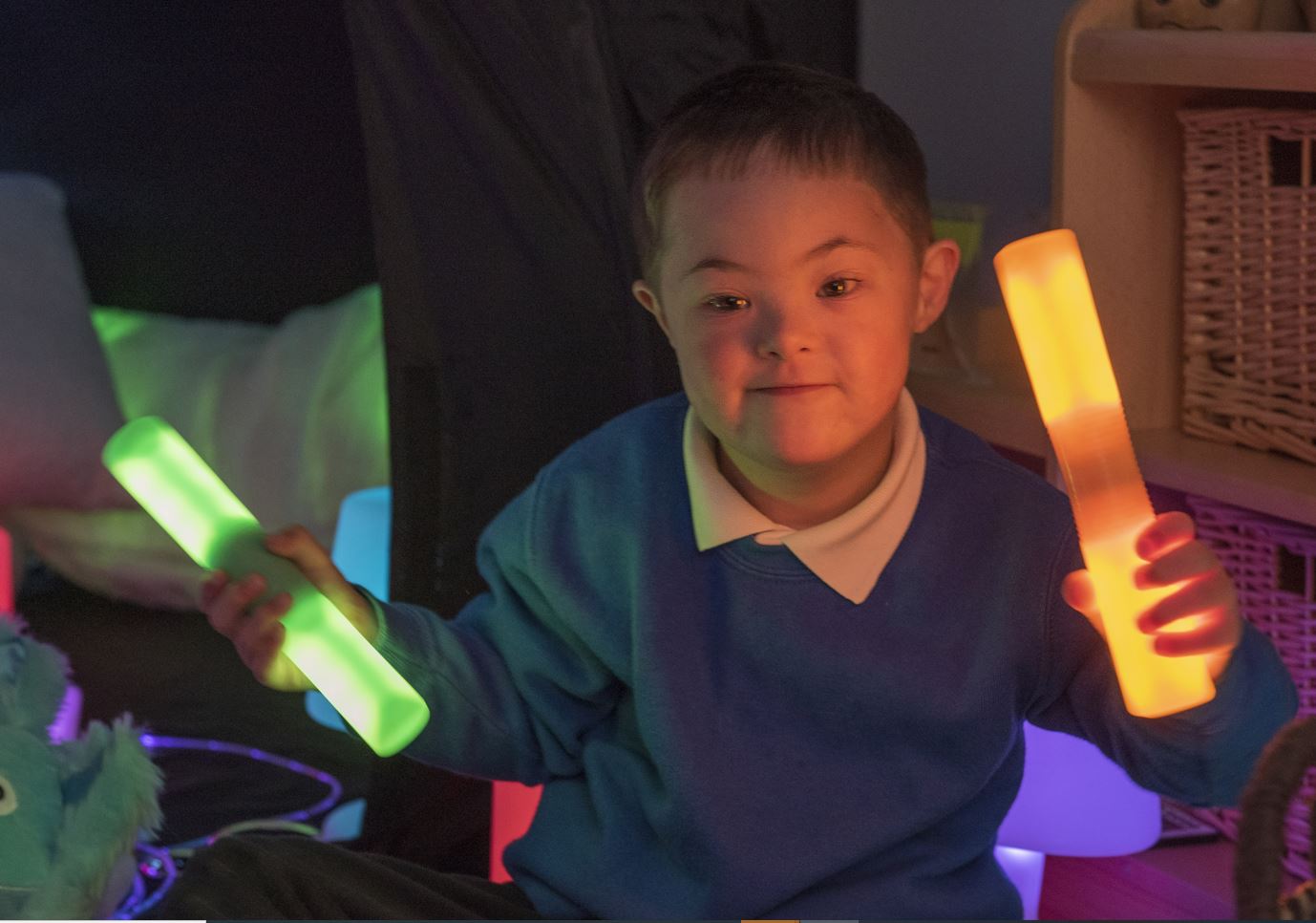 neurodivergent child sitting in a sensory space