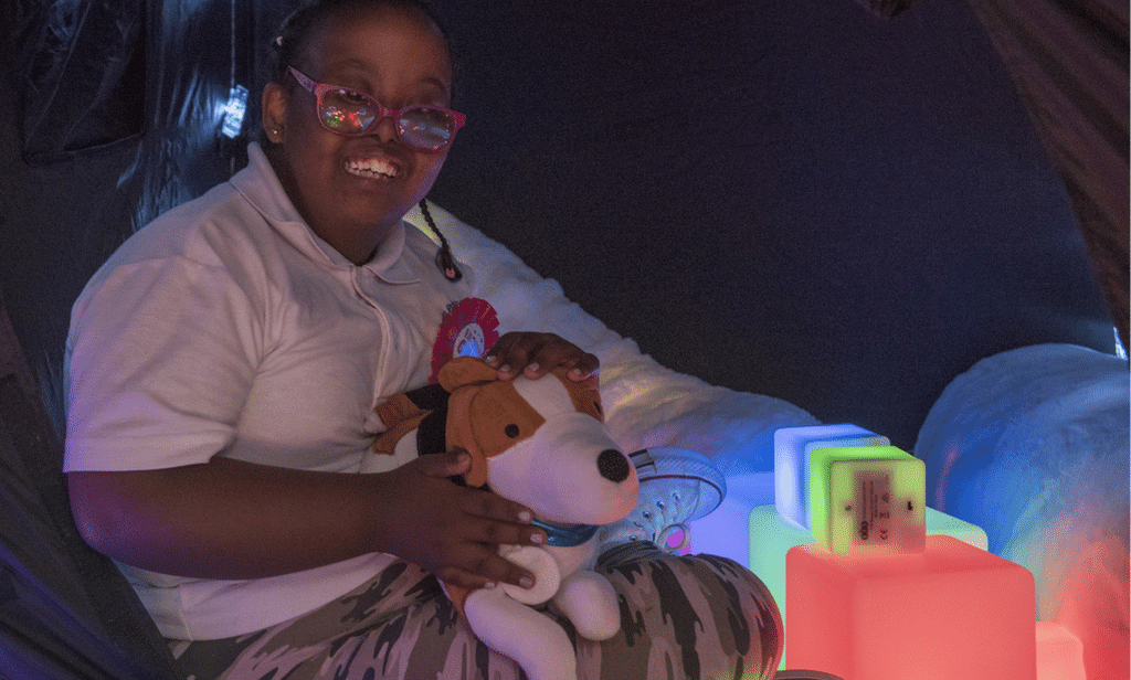 young girl playing in a pop up sensory space