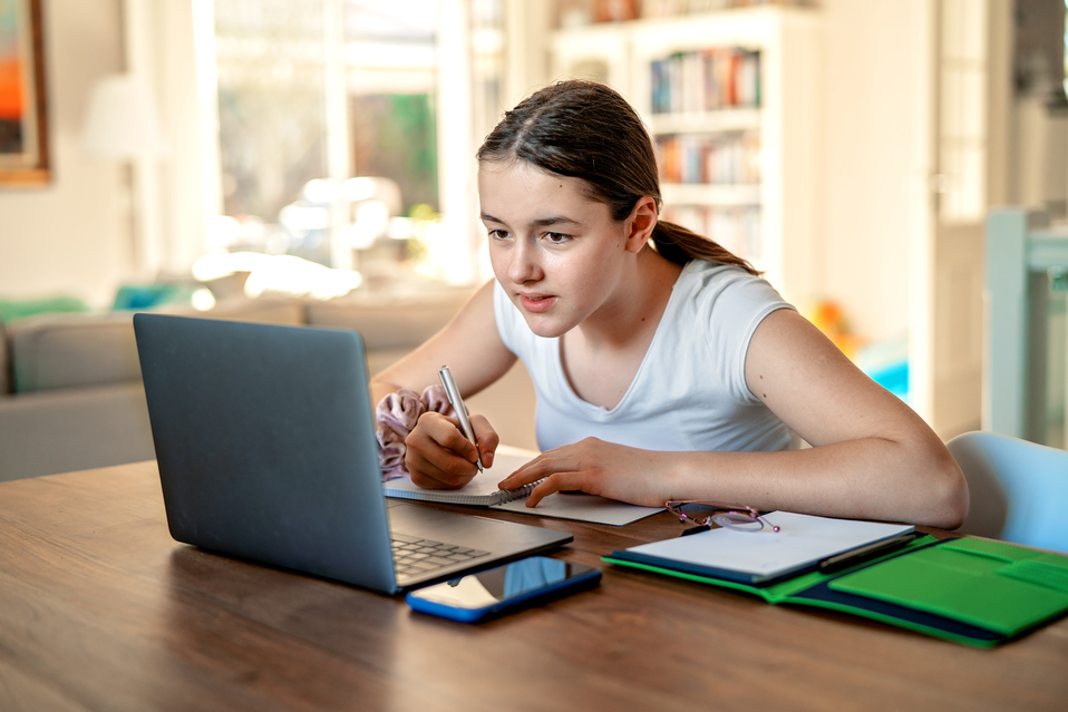 Girl looking at laptop