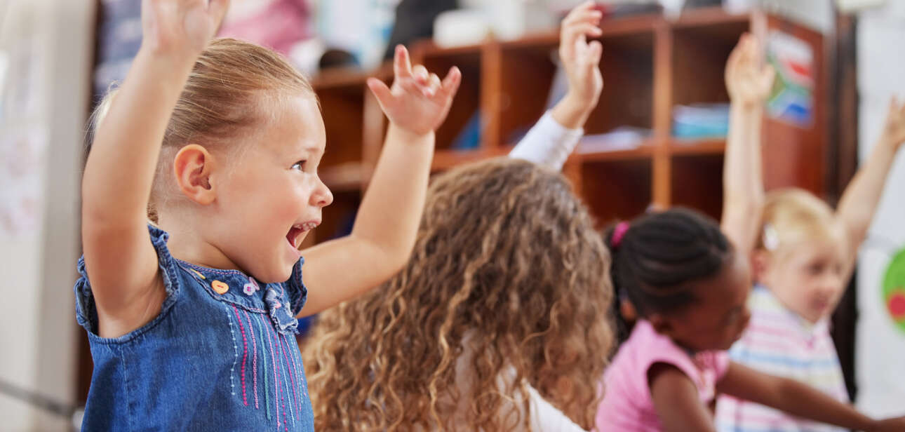 Shot of a group of children sitting in class