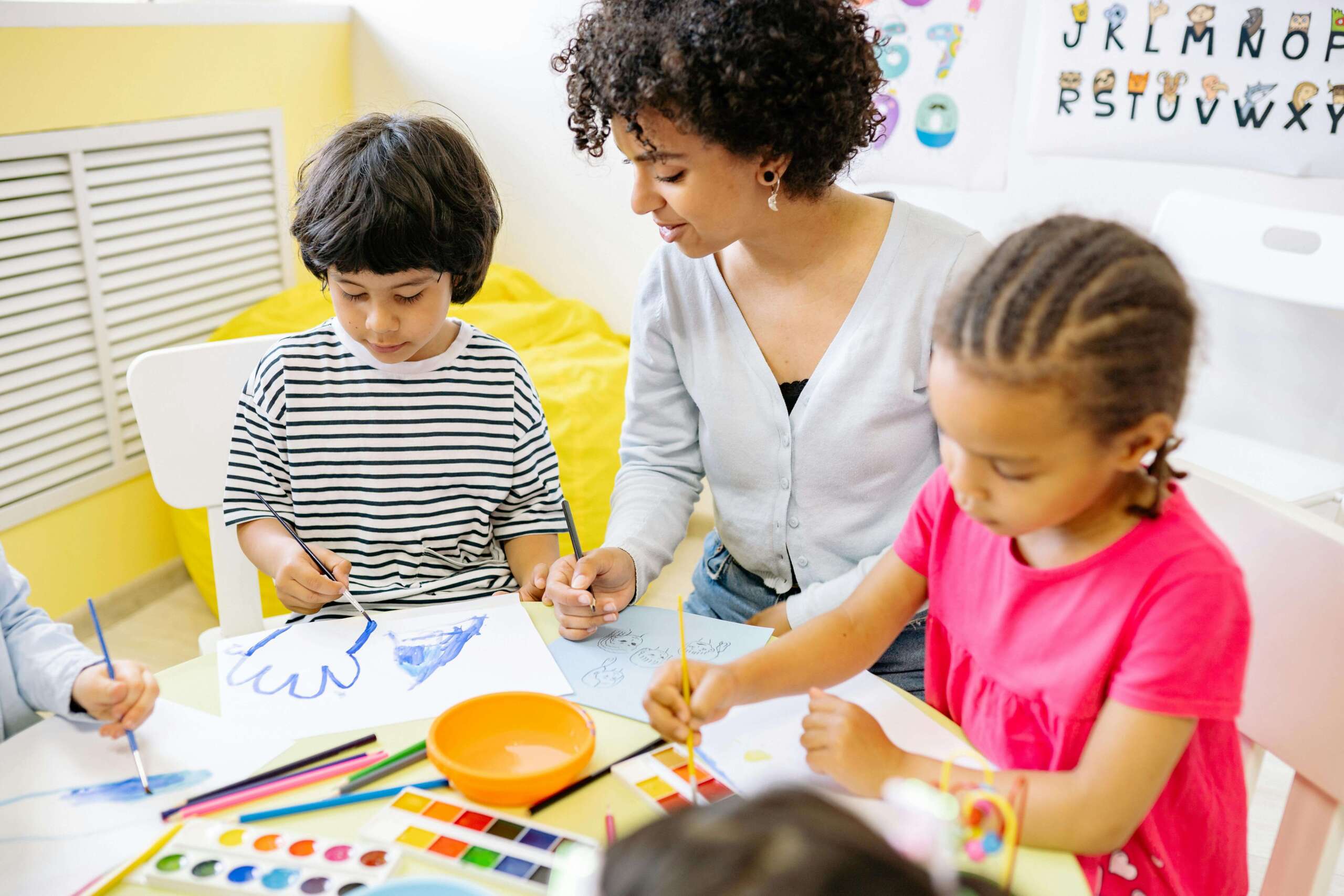early years educator playing with children